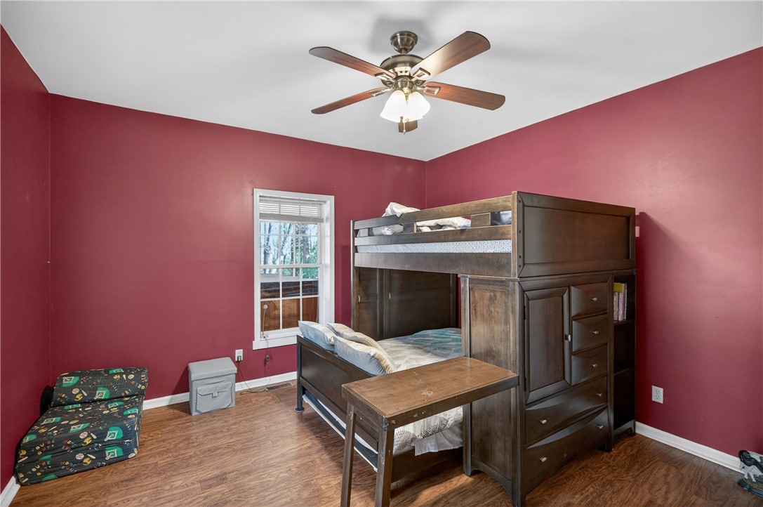 3400 Old Dobbins Bridge Road Fair Play, SC 29643 - Photo 16 of 50 This cozy room features durable flooring, a bright window, and a ceiling fan for comfort.