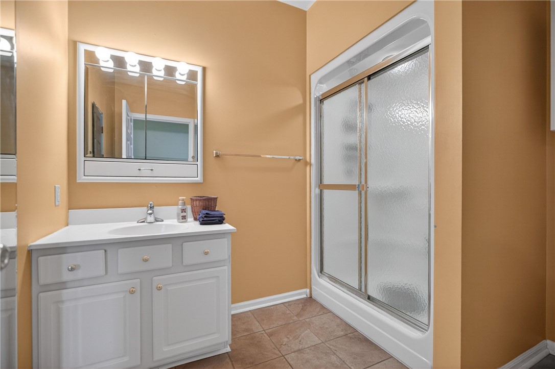3400 Old Dobbins Bridge Road Fair Play, SC 29643 - Photo 17 of 50 This bathroom features a sleek vanity and a practical shower, offering a blend of form and function.
