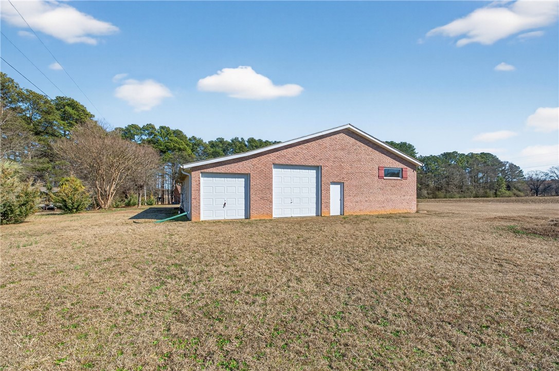 3400 Old Dobbins Bridge Road Fair Play, SC 29643 - Photo 34 of 50 This brick structure offers versatile garage and storage space on a spacious property.
