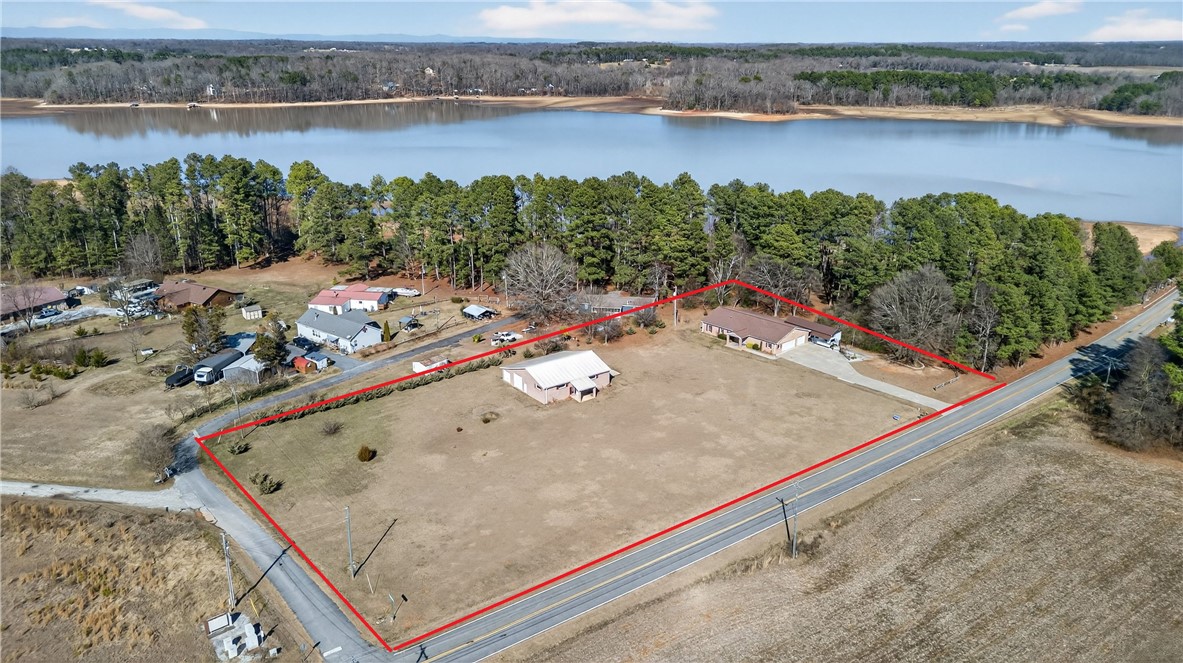 3400 Old Dobbins Bridge Road Fair Play, SC 29643 - Photo 45 of 50 This aerial perspective showcases a substantial lot with water access and surrounding woodlands.