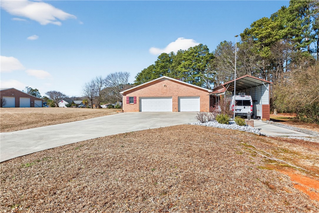 3400 Old Dobbins Bridge Road Fair Play, SC 29643 - Photo 49 of 50 This property features a spacious driveway and a convenient carport.