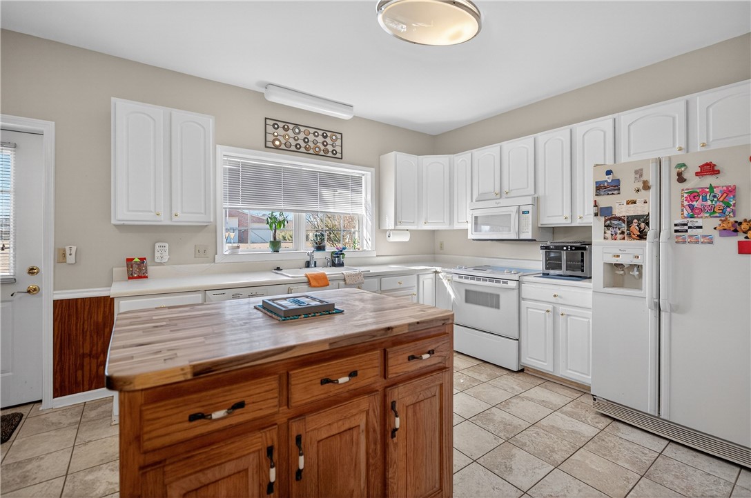 3400 Old Dobbins Bridge Road Fair Play, SC 29643 - Photo 9 of 50 This bright kitchen features ample cabinetry and a functional island, perfect for everyday living.