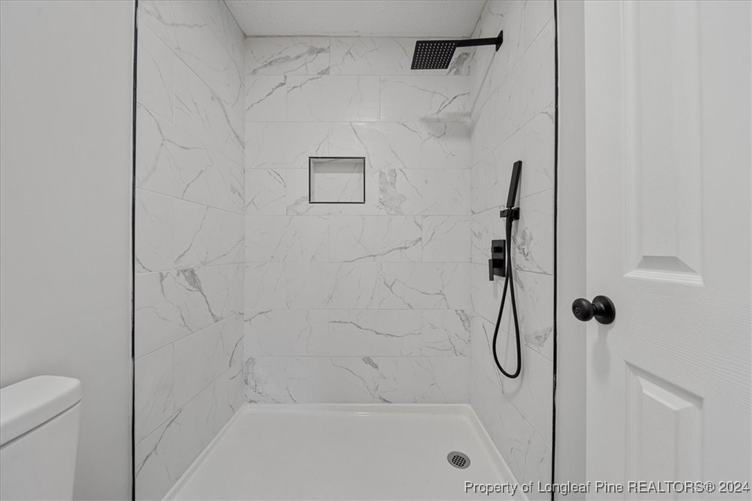 7847 Amesbury Road Fayetteville, NC 28311 - Photo 21 of 42 a bathroom with a shower