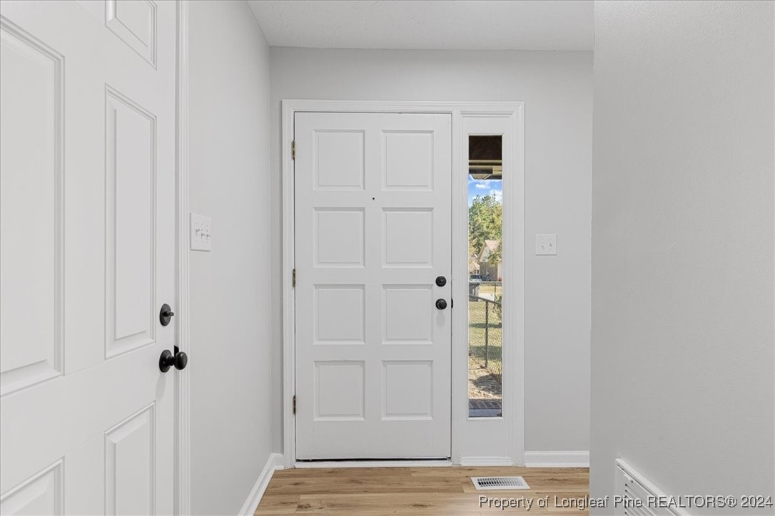 7847 Amesbury Road Fayetteville, NC 28311 - Photo 6 of 42 a view of entryway with wooden floor