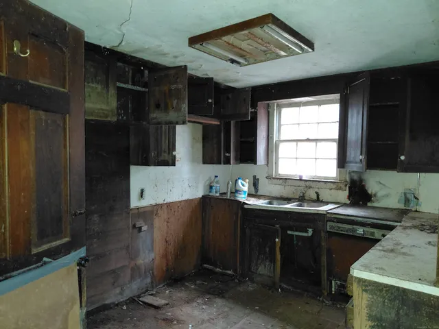 a kitchen with a sink and cabinets