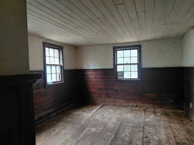 a view of empty room with windows