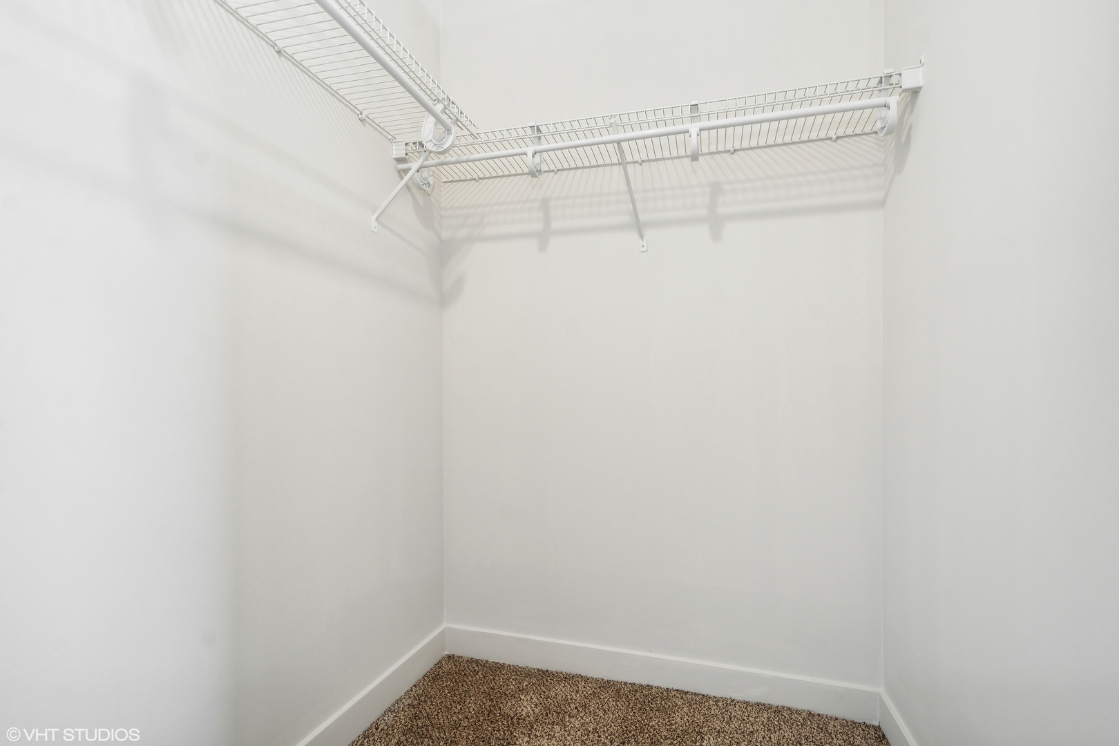 1791 West Howard Street, Unit 504 Chicago, IL 60626 - Photo 14 of 23 a view of a room with racks on the wall