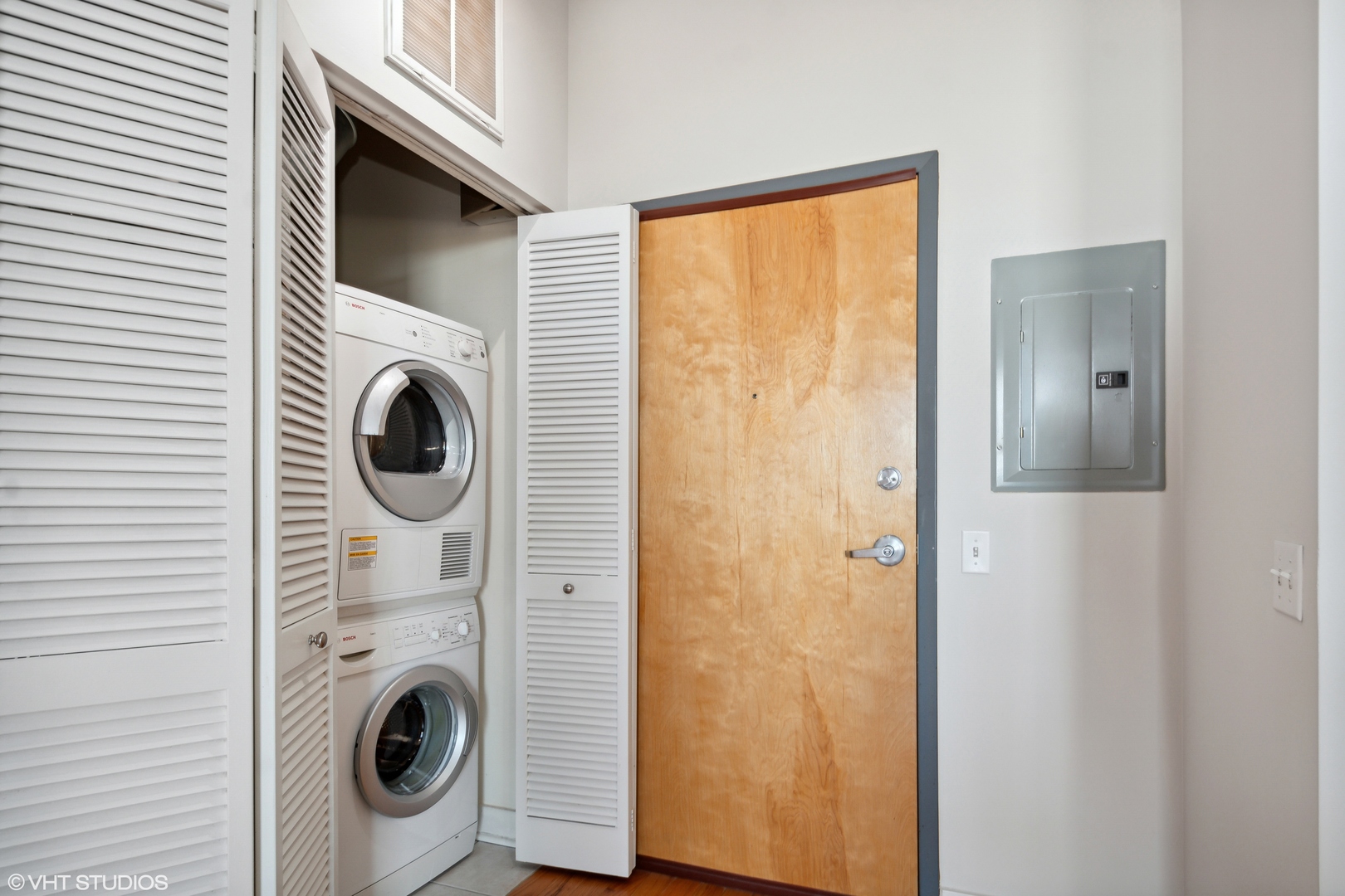 1791 West Howard Street, Unit 504 Chicago, IL 60626 - Photo 18 of 23 a view of a hallway with washer and dryer