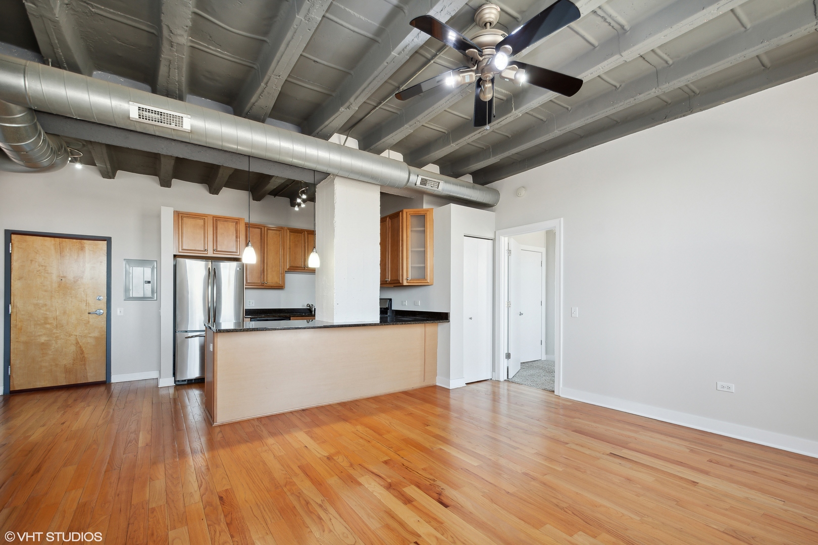 1791 West Howard Street, Unit 504 Chicago, IL 60626 - Photo 4 of 23 a view of empty room with wooden floor