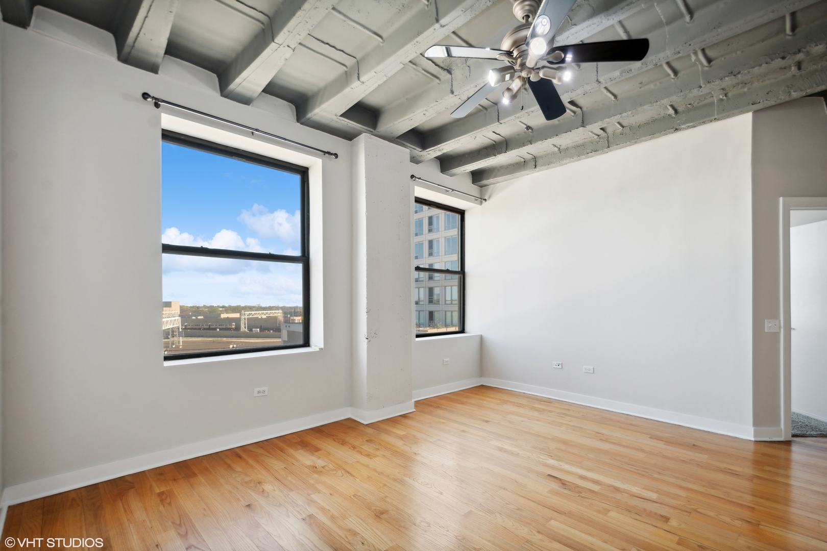 1791 West Howard Street, Unit 504 Chicago, IL 60626 - Photo 6 of 23 an empty room with windows