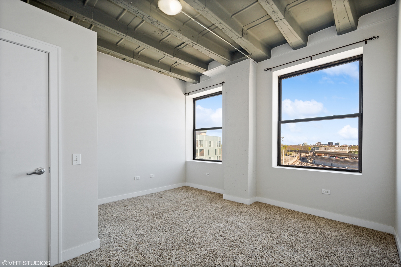 1791 West Howard Street, Unit 504 Chicago, IL 60626 - Photo 10 of 23 an empty room with windows