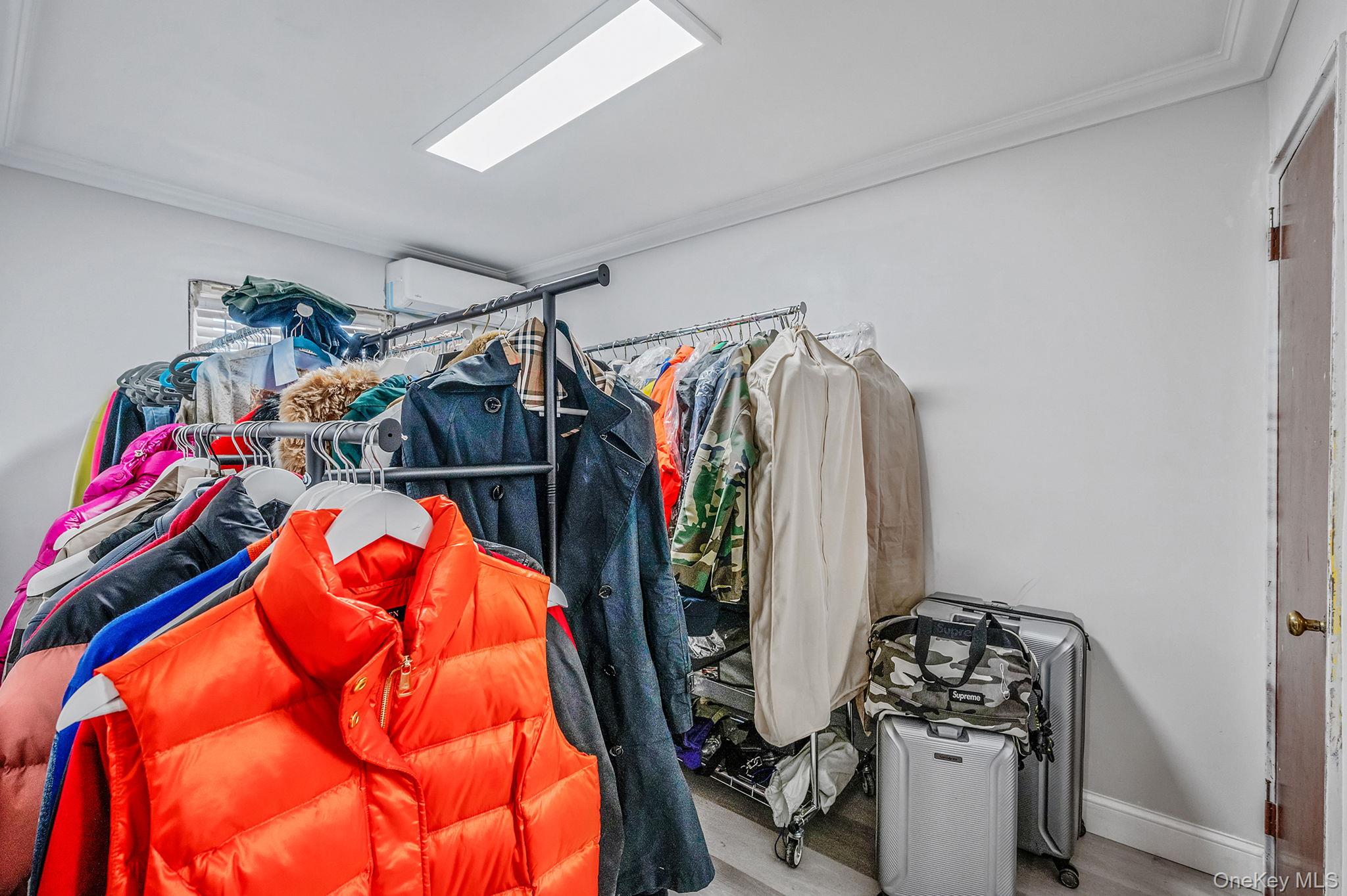 179-49 Eveleth Road Queens, NY 11434 - Photo 13 of 17 a view of walk in closet with clothes and shoes