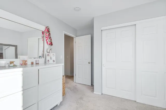 a bathroom with a sink vanity and mirror
