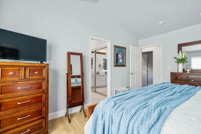 a bedroom with a bed and a dresser