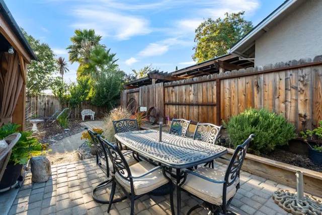 a view of backyard with a patio and outdoor seating