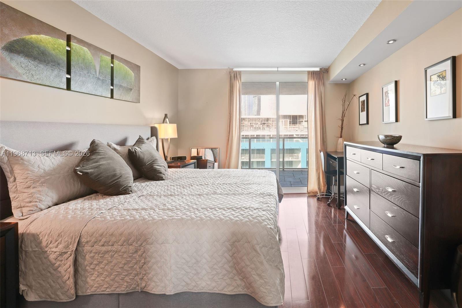 2101 Brickell Avenue, Unit 1704 Miami, FL 33129 - Photo 15 of 19 a large white bed in a white room