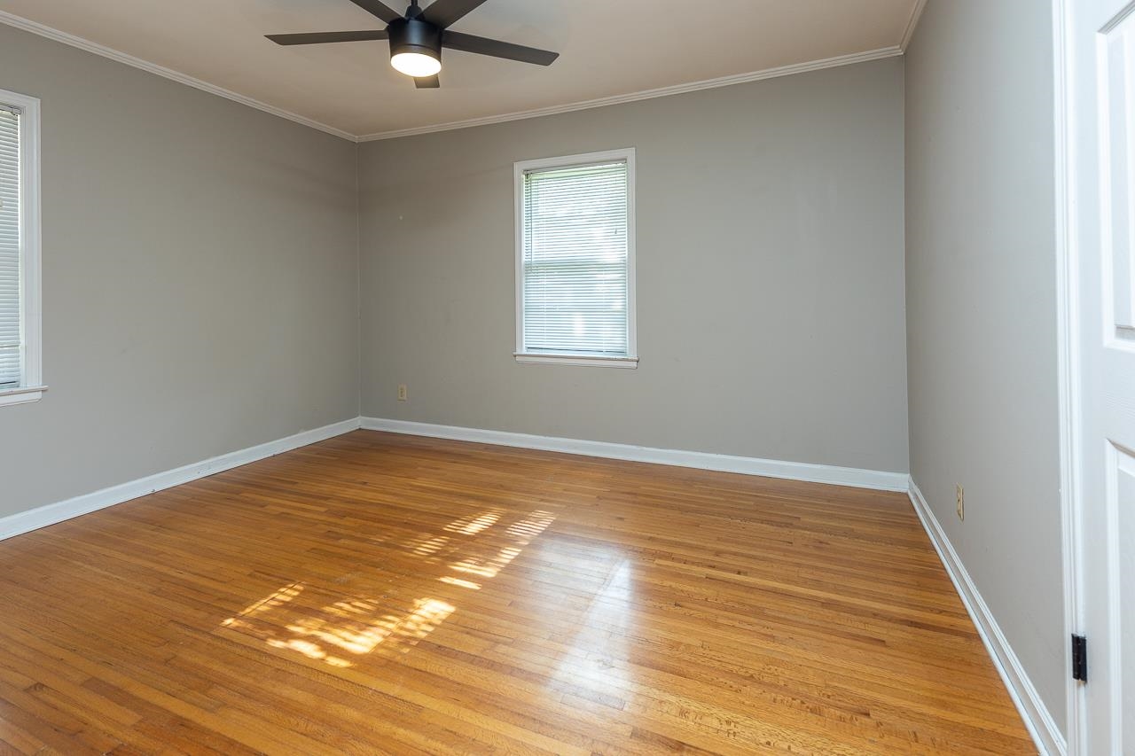 1604 Dearing Road Memphis, TN 38117 - Photo 14 of 18 a view of a room with wooden floor and a ceiling fan