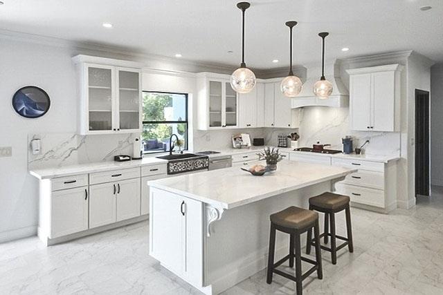 695 Quietwater Road Santa Rosa, CA 95404 - Photo 20 of 43 a kitchen with stainless steel appliances kitchen island granite countertop a sink a stove and a chandelier