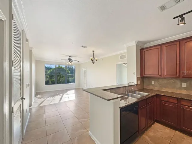 a kitchen with a sink stove and refrigerator