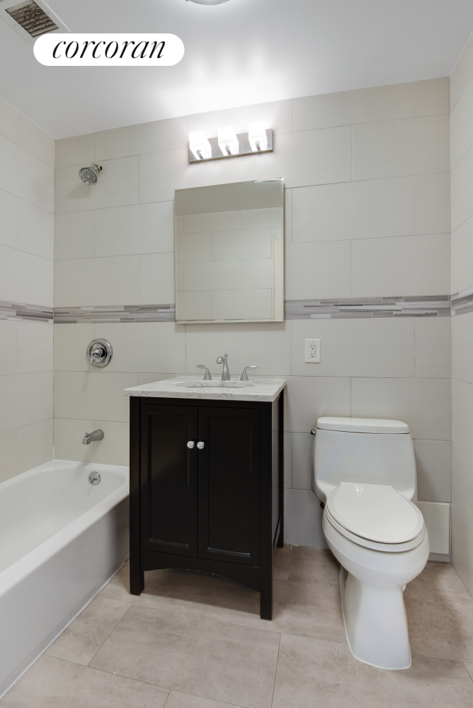 380 Lenox Avenue, Unit PHC Manhattan, NY 10027 - Photo 10 of 15 a bathroom with a sink a toilet and bathtub