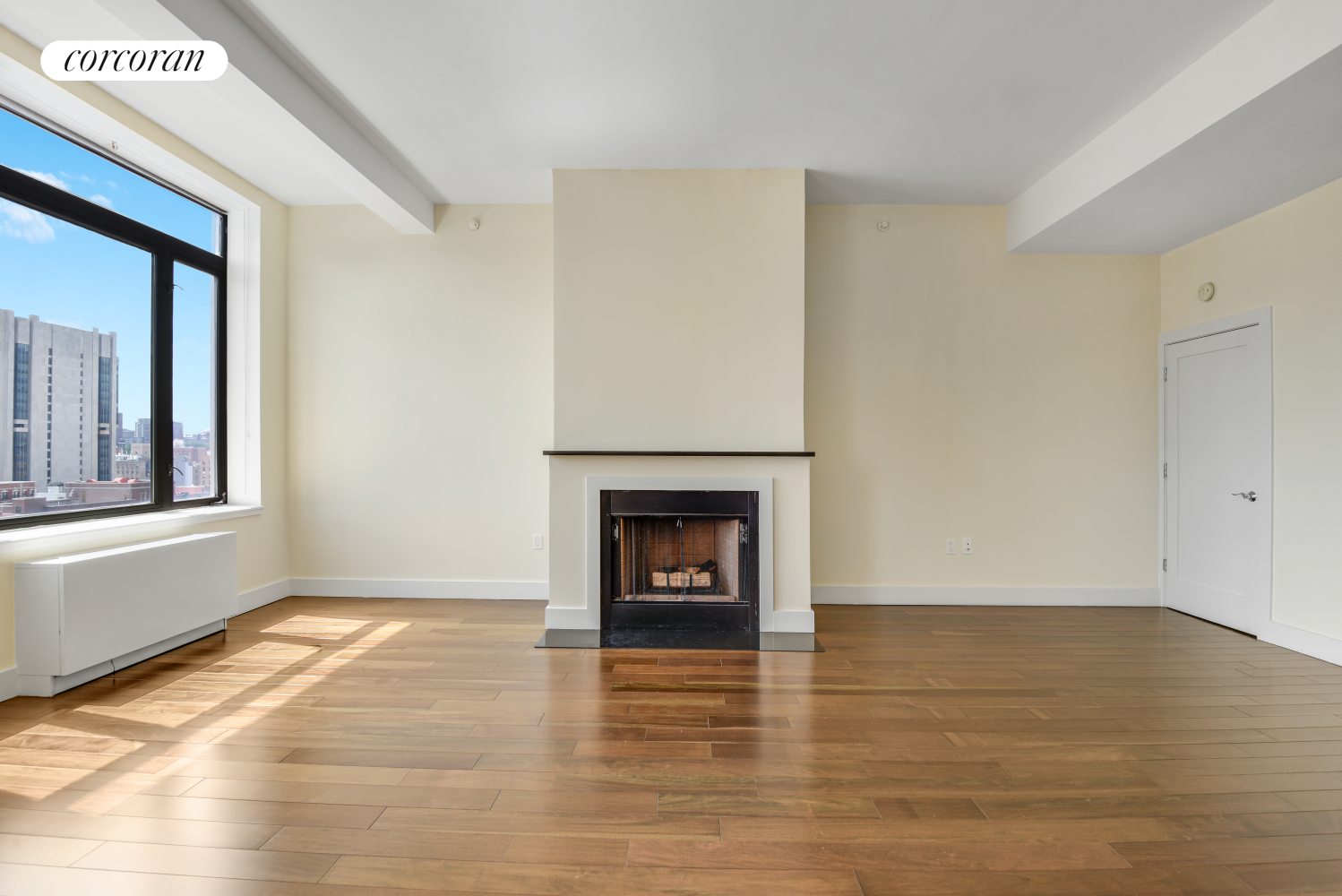 380 Lenox Avenue, Unit PHC Manhattan, NY 10027 - Photo 4 of 15 a view of an empty room with window and fire place