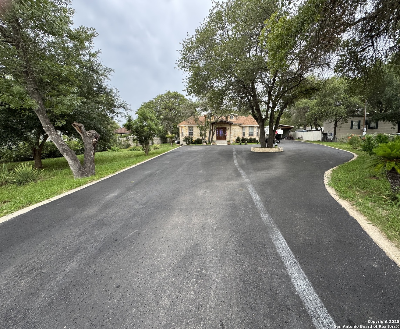 22739 Lazy Stream Drive Elmendorf, TX 78112 - Photo 16 of 20 a view of street with houses