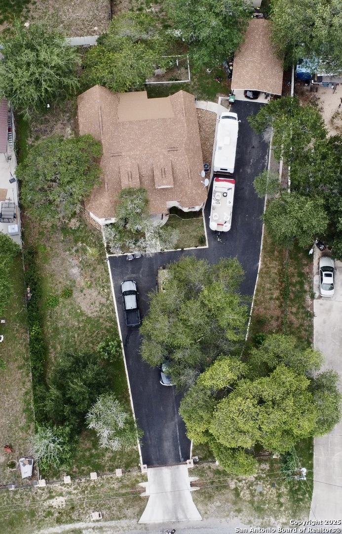 22739 Lazy Stream Drive Elmendorf, TX 78112 - Photo 20 of 20 an aerial view of a house with a yard