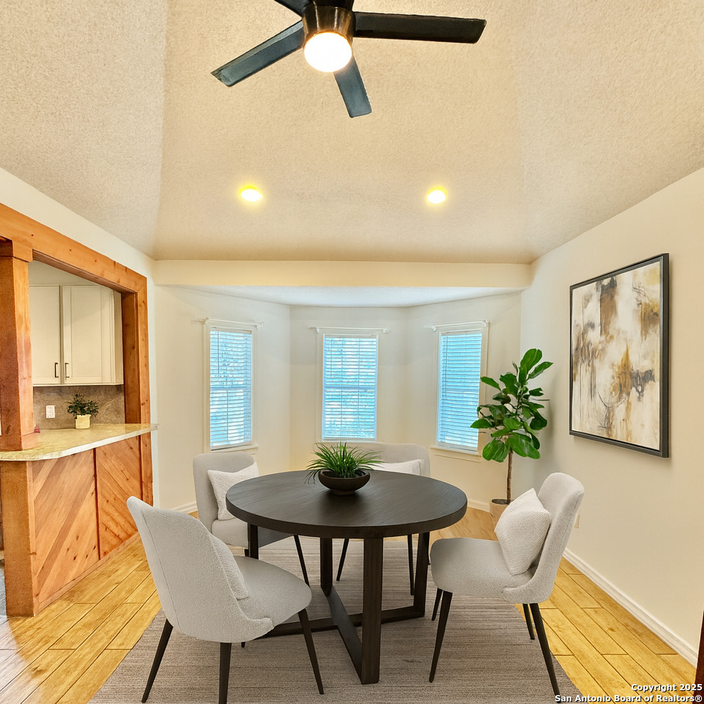 22739 Lazy Stream Drive Elmendorf, TX 78112 - Photo 5 of 20 a view of a dining room with furniture and a potted plant