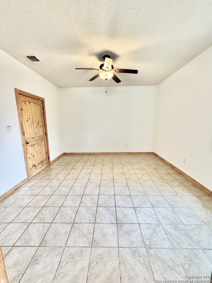 22739 Lazy Stream Drive Elmendorf, TX 78112 - Photo 7 of 20 a view of an empty room and window