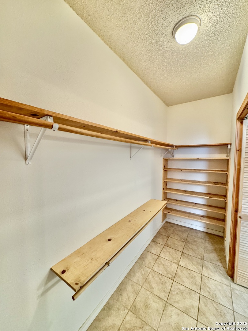 22739 Lazy Stream Drive Elmendorf, TX 78112 - Photo 8 of 20 a view of a room with a bench