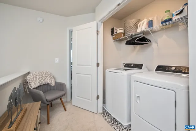 a view of kitchen and white cabinets