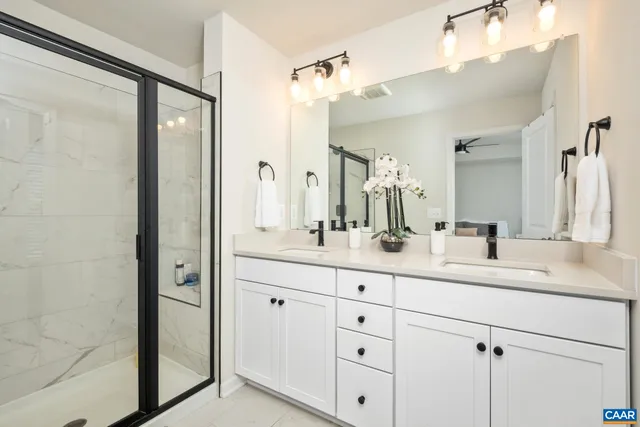a bathroom with a double vanity sink mirror and double