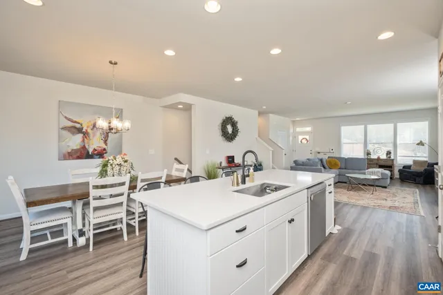 a kitchen with a sink stove and wooden cabinets