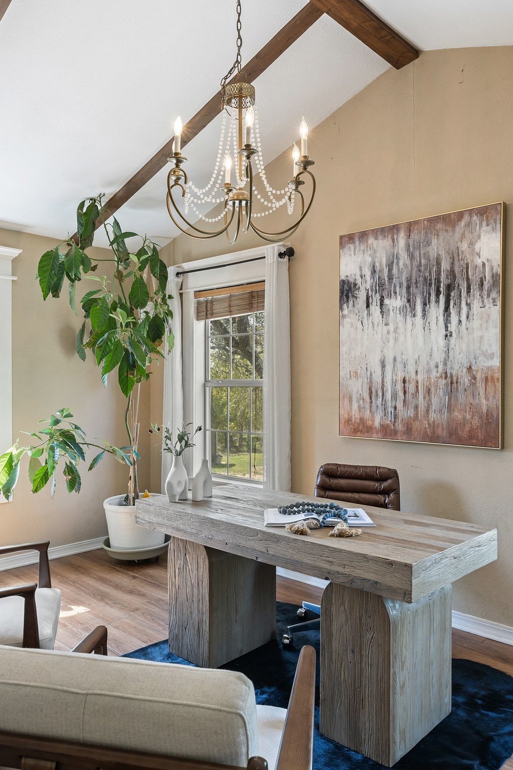 290 Sunset Ridge Dripping Springs, TX 78620 - Photo 14 of 39 a dining room with wooden floor a chandelier a wooden table and chairs
