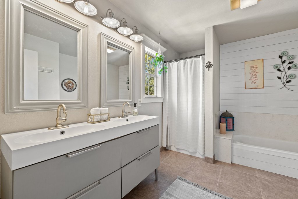 290 Sunset Ridge Dripping Springs, TX 78620 - Photo 14 of 39 Bathroom with double vanity and light tile patterned flooring