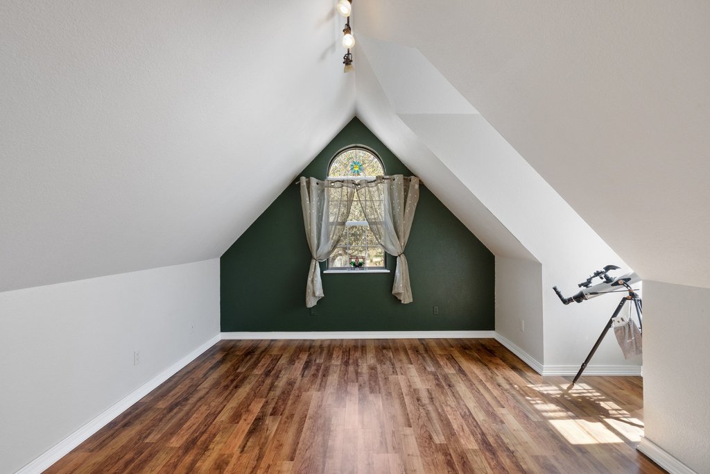 290 Sunset Ridge Dripping Springs, TX 78620 - Photo 17 of 39 Additional living space featuring baseboards and wood finished floors
