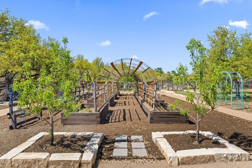 290 Sunset Ridge Dripping Springs, TX 78620 - Photo 20 of 39 View of community with a vegetable garden