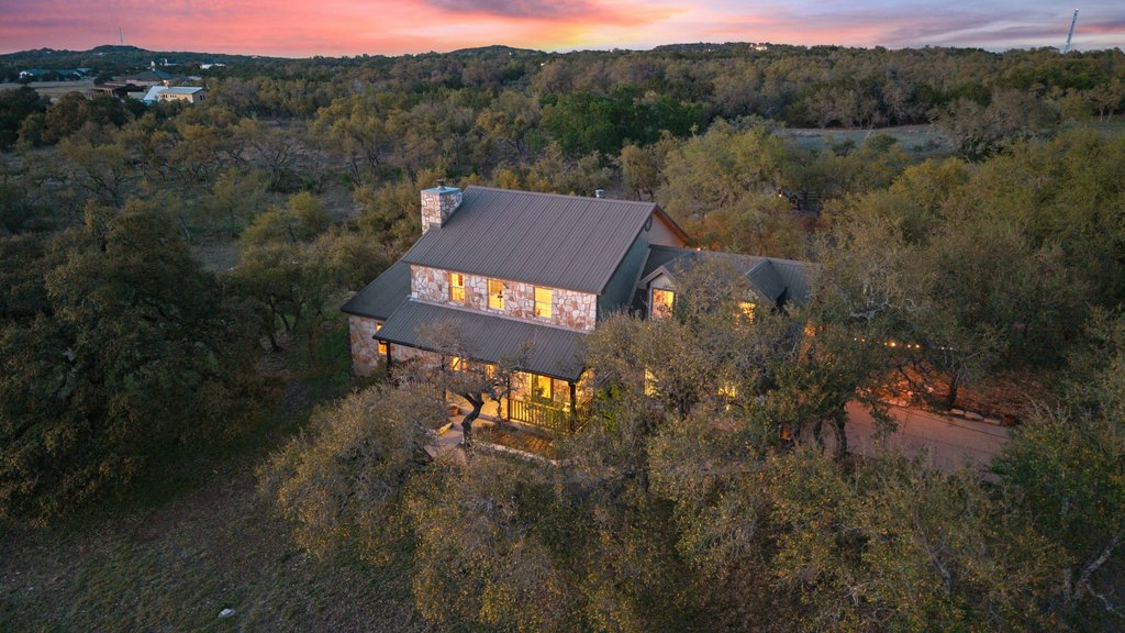 290 Sunset Ridge Dripping Springs, TX 78620 - Photo 2 of 39 View of subject property featuring a heavily wooded area