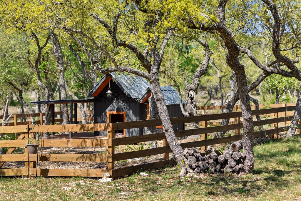 290 Sunset Ridge Dripping Springs, TX 78620 - Photo 28 of 39 Deck featuring an outbuilding