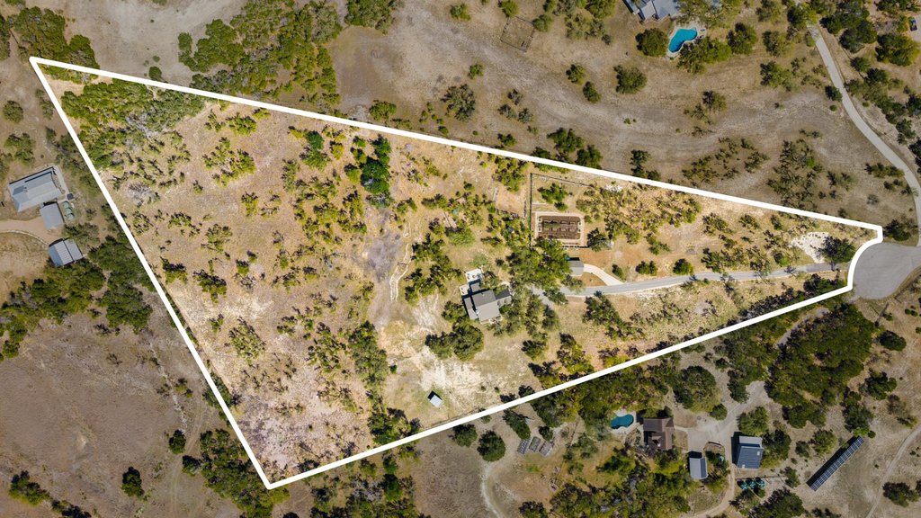 290 Sunset Ridge Dripping Springs, TX 78620 - Photo 3 of 39 Aerial view of sparsely populated area featuring a desert landscape and property boundaries highlighted