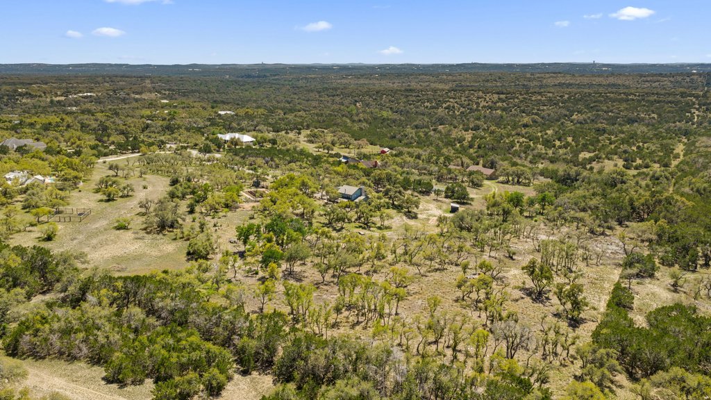 290 Sunset Ridge Dripping Springs, TX 78620 - Photo 39 of 39 Aerial view of a heavily wooded area