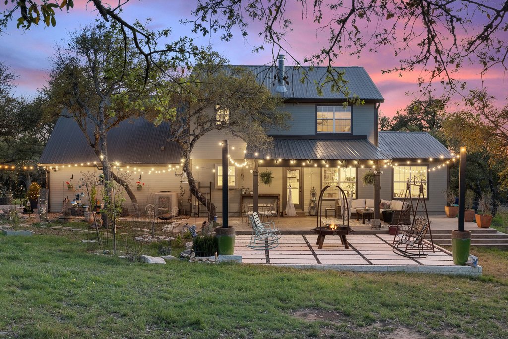 290 Sunset Ridge Dripping Springs, TX 78620 - Photo 4 of 39 a view of a house with a yard