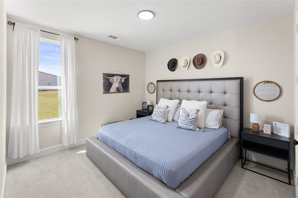 1568 County Road 3517 Quinlan, TX 75474 - Photo 15 of 30 a bedroom with a bed and a window