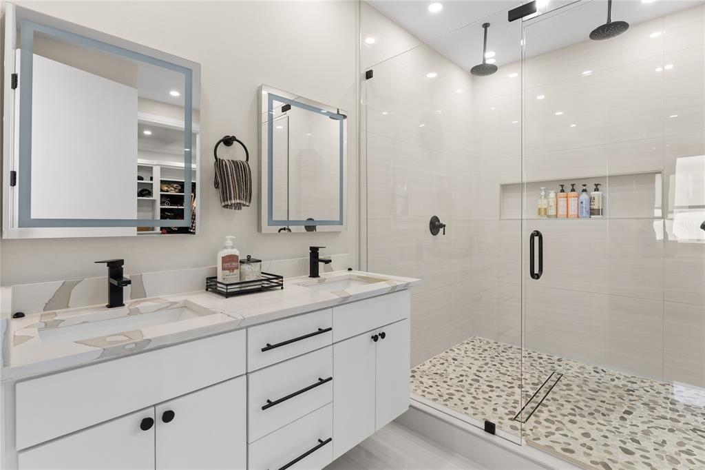 1568 County Road 3517 Quinlan, TX 75474 - Photo 16 of 30 a bathroom with a shower sink and mirror