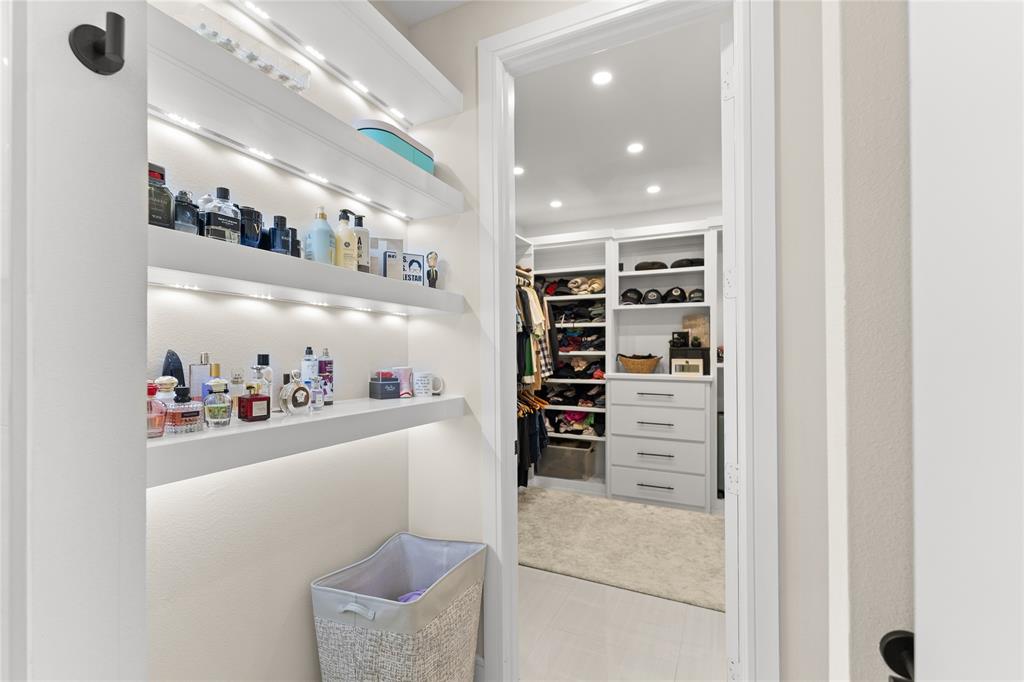 1568 County Road 3517 Quinlan, TX 75474 - Photo 18 of 30 a view of walk in closet with clothes and shoes
