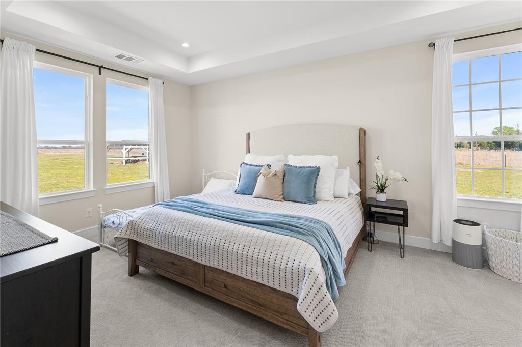 1568 County Road 3517 Quinlan, TX 75474 - Photo 19 of 30 a bedroom with a bed and a window