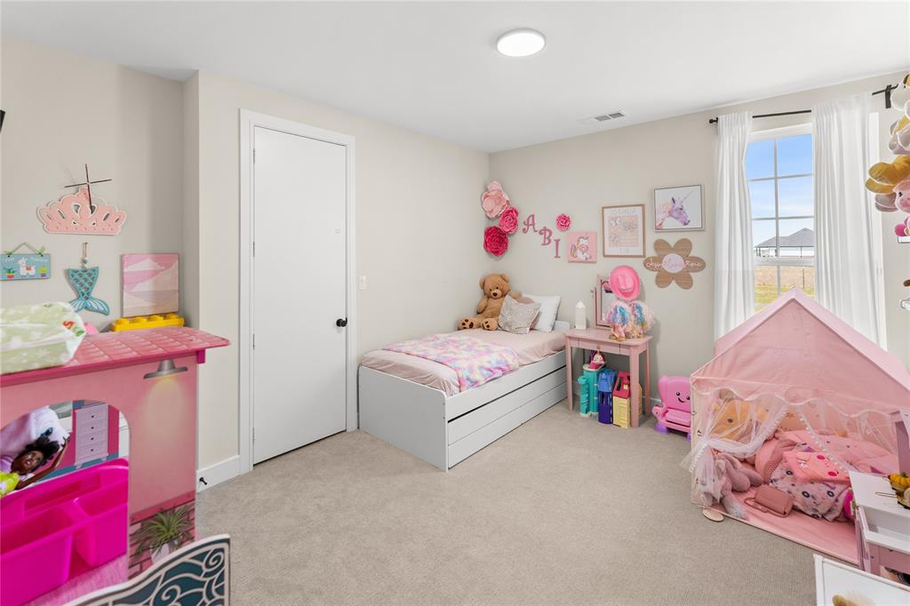 1568 County Road 3517 Quinlan, TX 75474 - Photo 21 of 30 a bedroom with a bed and a window
