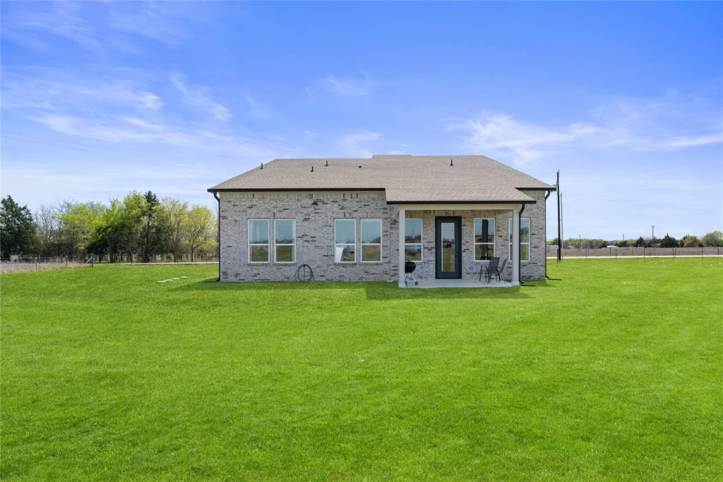 1568 County Road 3517 Quinlan, TX 75474 - Photo 25 of 30 a front view of a house with a garden