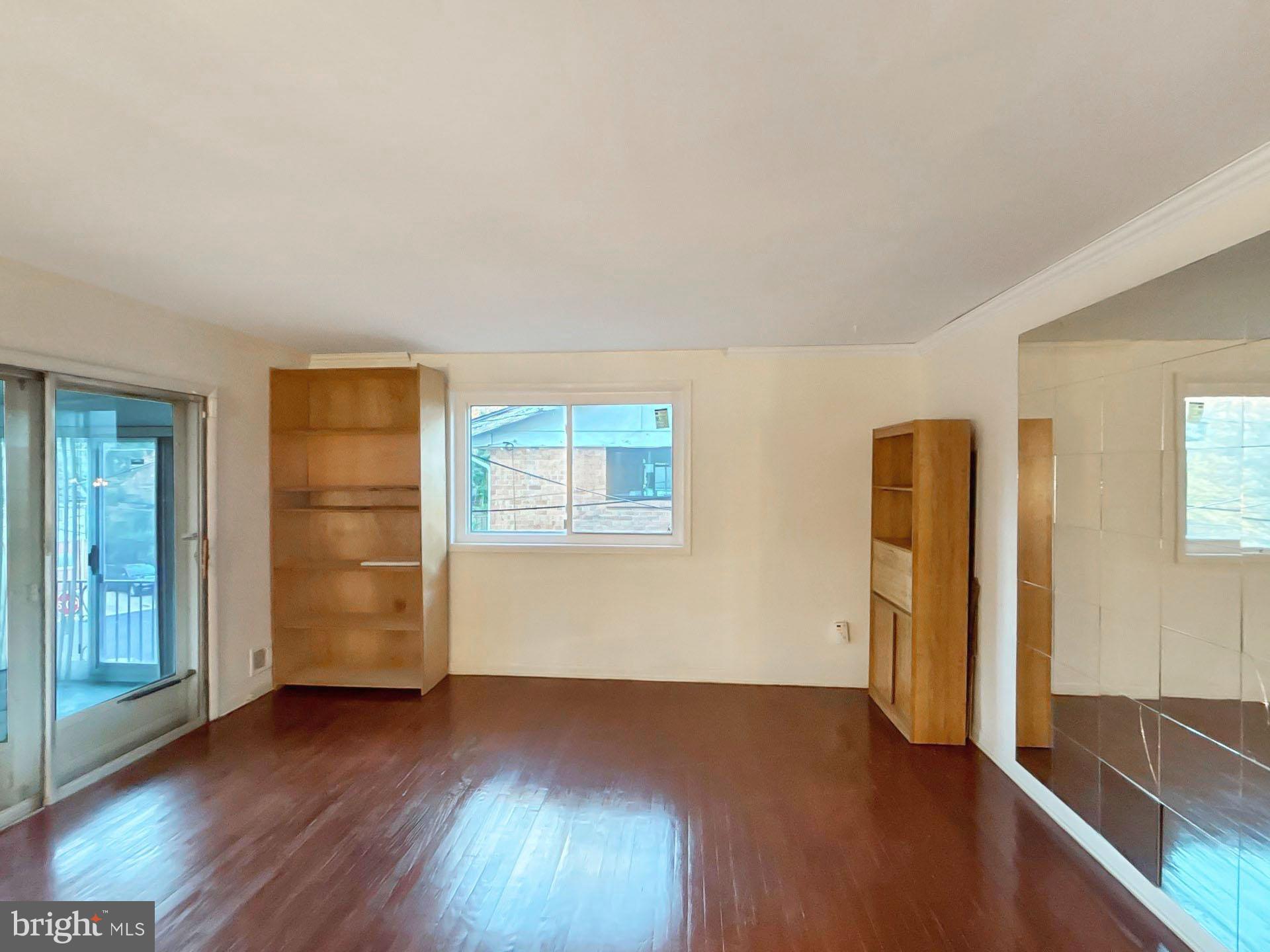 3323 Nash Place Southeast Washington, DC 20020 - Photo 4 of 23 an empty room with wooden floor and closet