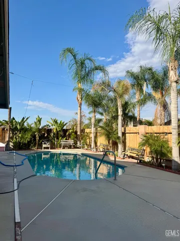 a view of street with palm trees